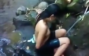 Indonesia girl alfresco nature shower