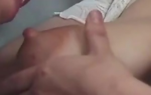 Western man breast feeding from her tits