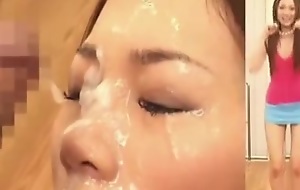 Cute and rather kinky Japanese hottie gets her pretty face showered wide of stash abundance of cum in this Asian bukkake video and it looks hot.